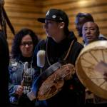 A welcome song is played and sang by Tulalip performers during a Road to Healing event at the Tulalip Gathering Hall in Marysville, Washington on Sunday, April 23, 2023. The tour is lead by United States Secretary of the Interior Deb Haaland and Department of the Interior Assistant Secretary Bryan Newland. (Annie Barker / The Herald)