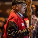A member of the color guard walks during the procession during a Road to Healing event at the Tulalip Gathering Hall in Marysville, Washington on Sunday, April 23, 2023. The tour is lead by United States Secretary of the Interior Deb Haaland and Department of the Interior Assistant Secretary Bryan Newland. (Annie Barker / The Herald)