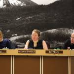 From left to right, City and Borough of Juneau Assembly members Carole Triem, Alicia Hughes-Skandijs and Wade Bryson listen to City Clerk Beth McEwen as she speaks about election code changes Monday night at the Assembly Committee of the Whole meeting where members OKd the city to move an ordinance to make vote-by-mail elections the default in Juneau. (Clarise Larson / Juneau Empire)