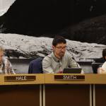 From left to right, City and Borough of Juneau Assembly members Michelle Bonnet Hale, Greg Smith and Christine Woll listen to discussion Wednesday night from other Assembly members about the community funding requests for the 2023 fiscal year budget. (Clarise Larson / Juneau Empire)