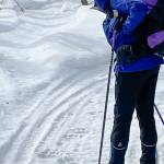 Kristen Rozell skis past grizzly bear tracks pressed into a snowmachine trail near Fairbanks on April 23, 2023. (Courtesy Photo / Ned Rozell)