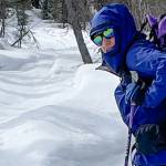 Kristen Rozell skis past grizzly bear tracks pressed into a snowmachine trail near Fairbanks on April 23, 2023. (Courtesy Photo / Ned Rozell)
