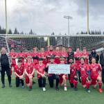 The Juneau-Douglas High School: Yadaa.at Kalé boys soccer team recently earned a Community Service Award from First Bank.  (Courtesy Photo)