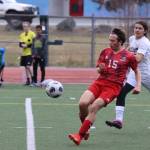 JDHS junior Oliver Zigmund (15) blocks a shot at Adair-Kennedy Field on Saturday against Ketchikan High School for the Bears first two conference games of the season. Zigmund puts in extra playing time by playing with both the JV and varsity team. (Jonson Kuhn / Juneau Empire)