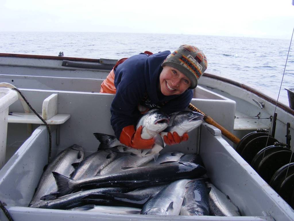 Shoreline Wild Salmon staff Adrienne Antoni poses with wild salmon caught individually for the day aboard the TommyL II. (Courtesy Photo / Joe Emerson)