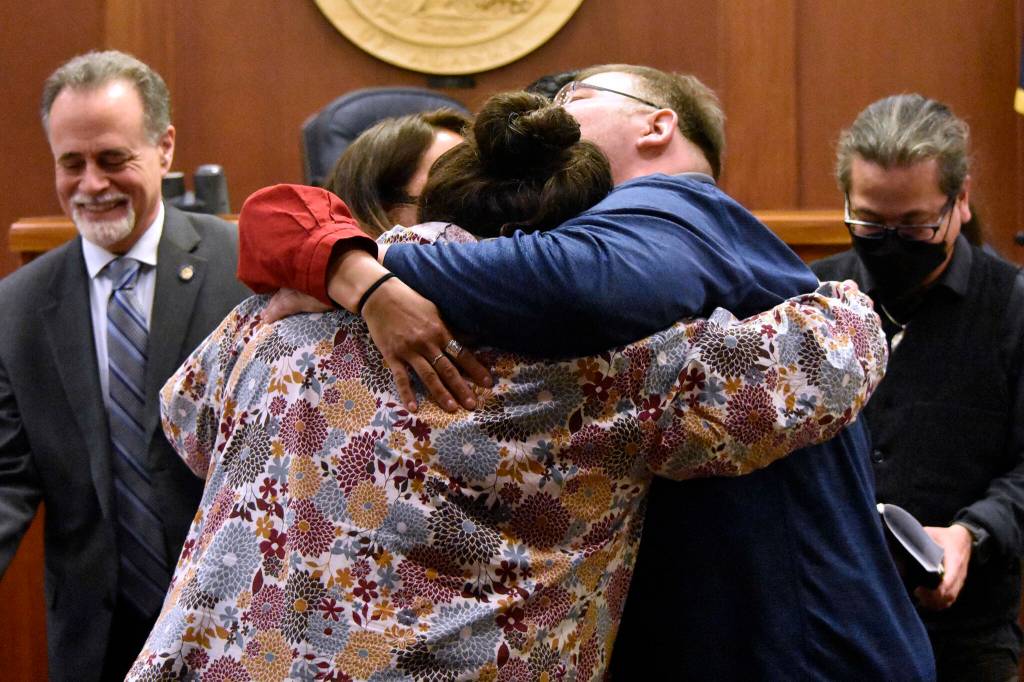 Tribal leaders hug in the Alaska State Senate chambers May 13, 2022, after the Senate passes a bill giving state recognition to 229 federally recognized Alaska Native tribes. (Peter Segall / Juneau Empire)