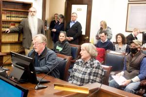 `Mark Sabbatini / Juneau Empire
James and Claudia Criss of Juneau testify Tuesday during a House State Affairs Committee meeting in opposition to a bill that would repeal ranked choice voting and open primaries in Alaska.