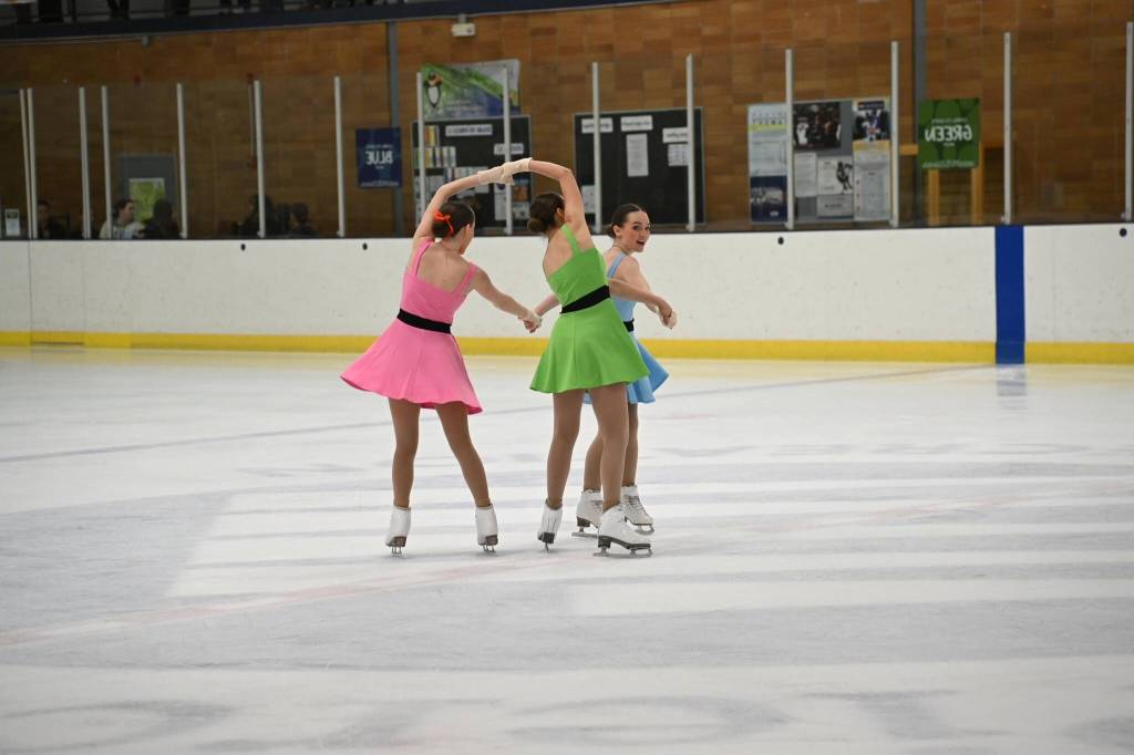 Aliyah Overturf, Carly Phelps and Lydia Powers perform as the Powerpuff Girls Trio, which came in first place in the Ensemble Event for this years Ice Sports Industry West Coast Championship in Tacoma, Washington. Powers in pink, Overturf in Green and Phelps in blue. (Courtesy Photo / Marianne Oelund)