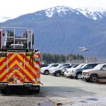 A Capital City Fire/Rescue truck parks near a privately owned airport hangar at the Juneau International Airport after Capital City Fire/Rescue extinguished a fire in the building Thursday morning. (Clarise Larson / Juneau Empire)