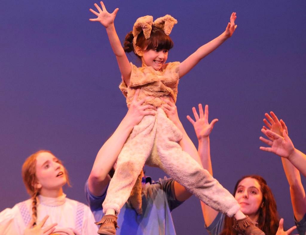 Delia Grimes,7, plays the part of Toto in this years rendition of The Wizard of Oz, which has a cast consisting of both JDHS and TMHS students and is performed at the JDHS auditorium. (Jonson Kuhn / Juneau Empire)
