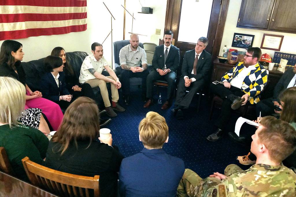 A group of LGBTQ+ residents and state lawmakers meet with media members at the Alaska State Capitol on Tuesday following a meeting with Gov. Mike Dunleavy to discuss House Bill 99, which would ban discrimination based on sexual orientation of gender identity. (Mark Sabbatini / Juneau Empire)