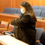 Elena-Kenatsú Truitt, a House page, puts paperwork on chairs at the rear of the House chamber in preparation for Senators who will be attending a joint session of the Legislature on Tuesday to vote on Gov. Mike Dunleavys nominees to dozens of state positions. (Mark Sabbatini / Juneau Empire)