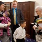 State Rep. Josiah Patkotak, I-Utqiagvik, left, holds his daughter, Francine Jo, seven months old, while his son, Dillion, 7, greets Chief House Clerk Crys Jones and Rep. David Eastman, R-Wasilla, looks on before the start of the House floor session Saturday. It is the first weekend floor session this year for both the House and Senate as they try to conclude their legislative business before their scheduled adjournment Wednesday. (Mark Sabbatini / Juneau Empire)