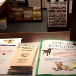 A retirement card for Skiff Lobaugh, human resources manager, awaits signatures from legislators and other employees at the documents window in the Alaska State Capitol on Thursday. Lobaugh and other longtime employees who are departing are getting official recognitions and citations from lawmakers during floor sessions as part of their sendoff. (Mark Sabbatini / Juneau Empire)