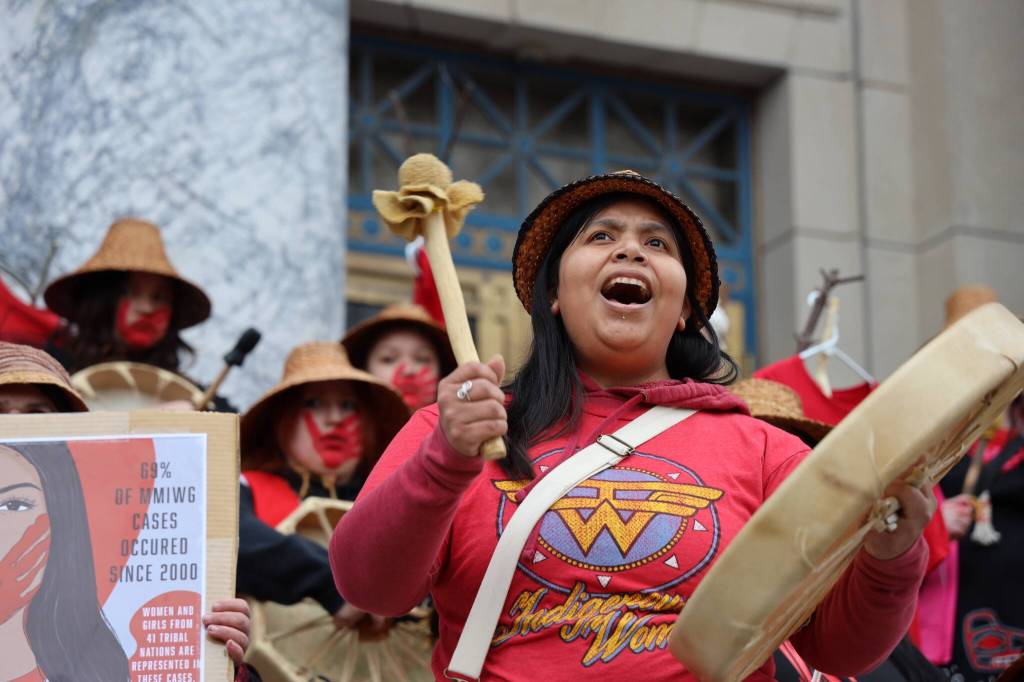 Bamby Kinville-James leads a song during the rally held at the steps of the Alaska State Capitol Friday evening to recognize Missing and Murdered Indigenous Peoples Awareness Day held each year on May 5. (Clarise Larson / Juneau Empire)