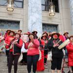 Bamby Kinville-James (left center) and Jeni Brown (right center) lead a song during the rally held at the steps of the Alaska State Capitol Friday evening to recognize Missing and Murdered Indigenous Peoples Awareness Day held each year on May 5. (Clarise Larson / Juneau Empire)