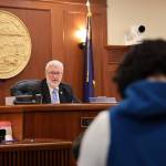 Senate President Gary Stevens, a Kodiak Republican, listens to Sen. Löki Tobin, an Anchorage Democrat, as she speaks in support of a bill Stevens sponsored that would require Alaska high school students to complete a civics education course or receive a passing score on a civics assessment exam in order to graduate. (Clarise Larson / Juneau Empire)