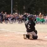 Parker Katasse, 12, gets ready to catch the ceremonial first pitch of the Gastineau Channel Little League baseball season Saturday at Adair-Kennedy Memorial Park. Katasse is the great grandson of Richard Adair, one of two police officers killed in the line of duty for whom the park is named. Although Katasse primarily plays short stop, he had no trouble handling the pitch. (Ben Hohenstatt / Juneau Empire)