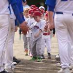 The Scrappers led by Ayden Thibodeau in front make their way through a line of Thunder Mountain High School baseball players on Gastineau Channel Little Leagues opening day. Forty teams took part in festivities held Saturday at Adair-Kennedy Memorial Park. (Ben Hohenstatt / Juneau Empire)