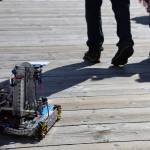 A robot built by students from the Capital City Dynamics Robotics Club at Juneau-Douglas High School:Yadaa.at Kalé drives around Elizabeth Peratrovich Plaza Saturday afternoon during 2023 Juneau Maritime Festival. Junior Paul King and freshman James Rosson were collecting donations throughout the event as they drove their creation. (Clarise Larson / Juneau Empire)