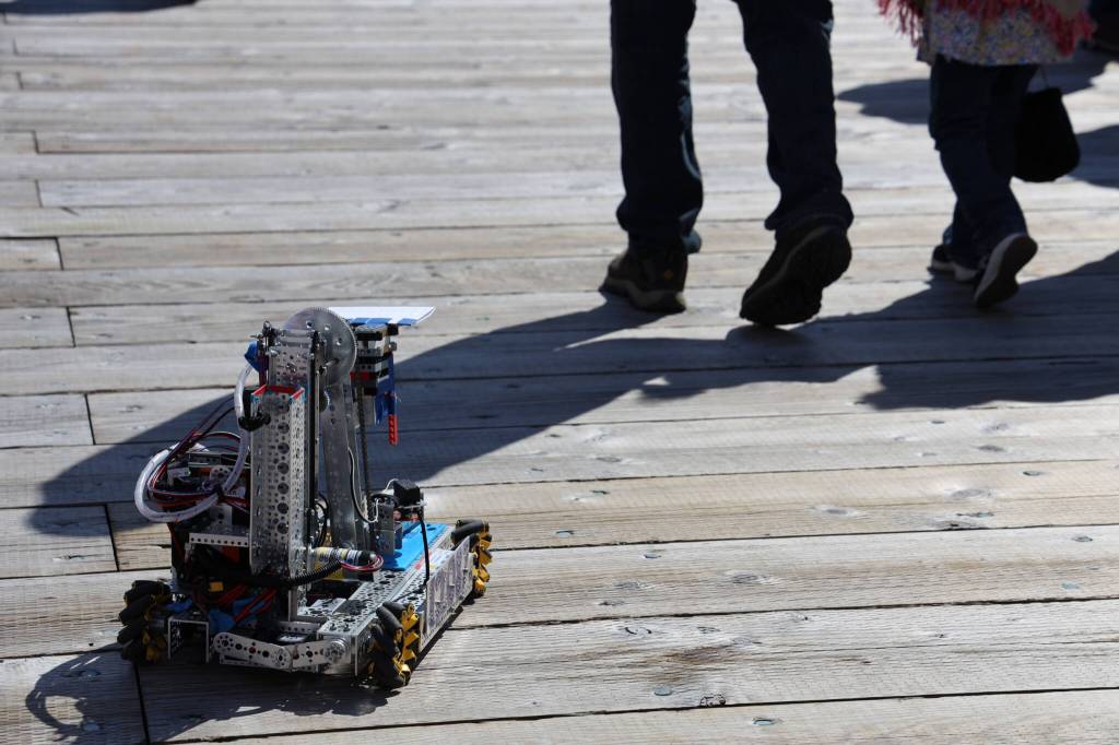A robot built by students from the Capital City Dynamics Robotics Club at Juneau-Douglas High School:Yadaa.at Kalé drives around Elizabeth Peratrovich Plaza Saturday afternoon during 2023 Juneau Maritime Festival. Junior Paul King and freshman James Rosson were collecting donations throughout the event as they drove their creation. (Clarise Larson / Juneau Empire)