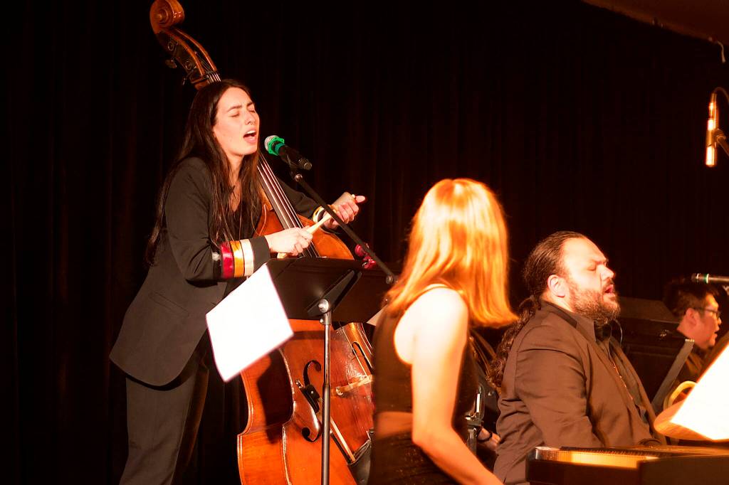 Bassist Mali Obomsawin leads Tlingit drummer Ed Littlefield and other musicians in a chant in her Indigenous language of Abenaki during a performance of her song Blood Quantum as the finale of a concert by the Julia Keefe Indigenous Big Band on Friday at Elizabeth Peratrovich Hall. She said the chant honors her peoples matriarchs and grandmothers, and a willingness to face or fight anything that diminishes their health and the health of the community. (Mark Sabbatini / Juneau Empire)