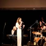 A red dress hanging at one end of the stage serves as recognition of the National Day of Awareness for Missing and Murdered Indigenous Women and Girls during a concert by the Julia Keefe Indigenous Big Band on Friday night at Elizabeth Peratrovich Hall. (Mark Sabbatini / Juneau Empire)