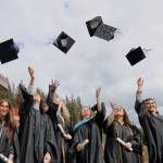 Graduates Emily Hatley, Lara Millette, Autumn Levy, Rosaline Westfall, Rylee Johnson and Jarvis Evans throw their caps in the air after the commencement ceremony held Sunday afternoon at the University of Alaska Southeast. (Clarise Larson / Juneau Empire)