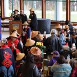 Faculty and dancers hand out gifts of water and body butter to graduates and family members during the Annual Native Graduation Celebration at the Egan Library Saturday morning before commencement. (Clarise Larson / Juneau Empire)