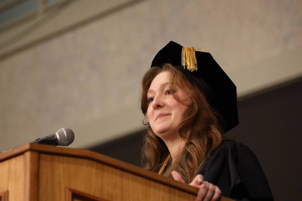 Student speaker Kali Spencer, who received her Bachelors of Liberal Arts in Interdisciplinary Studies, shares memories and advice to fellow graduates at the 2023 University of Alaska Southeast commencement ceremony Sunday afternoon. (Clarise Larson / Juneau Empire)