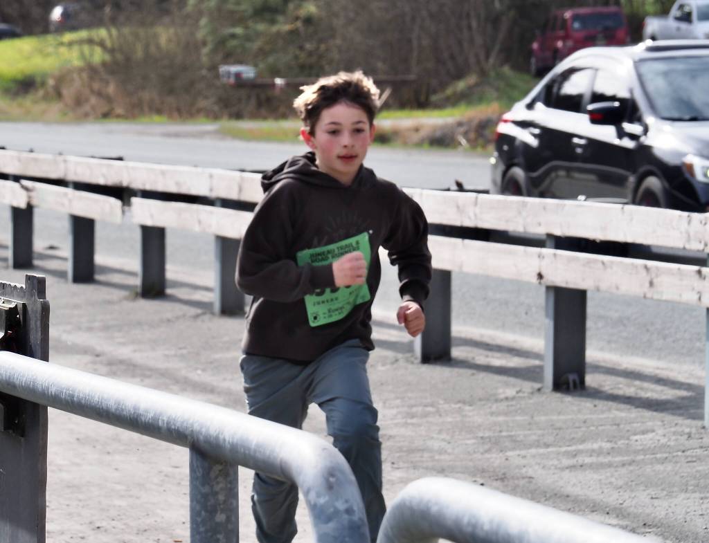 Rowan Taintor, 10, wins the one-mile run in the Magnificent Mendenhall Mudpuddle Meet on Saturday. (Courtesy Photo / Quinn Tracy/ Heather Parker)
