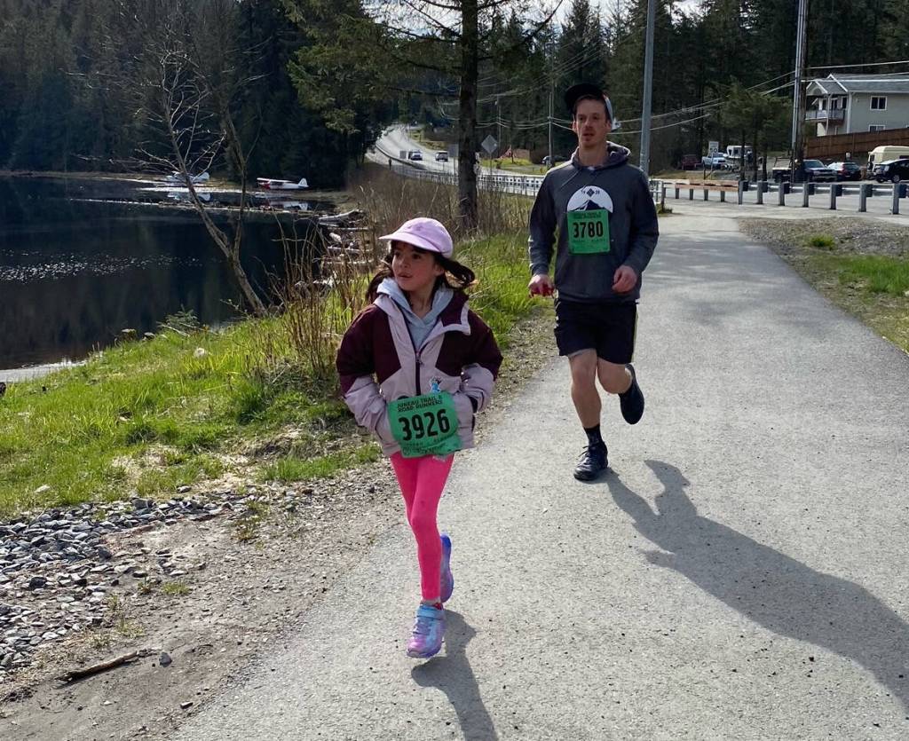 Amelin Kreuger (3926), 7, and Dylan Kreuger (3780) finish the 1-mile run in the Magnificent Mendenhall Mudpuddle Meet on Saturday. (Courtesy Photo / Quinn Tracy/ Heather Parker)