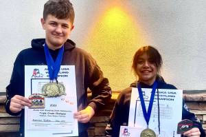 Darren Foster and Nixie Schooler with some of their gold medals and their prestigious Triple Crown belt buckles at the USA Wrestling Alaska State Championships at the Menard Center in Wasilla from May 3-7. (Courtesy Photo / Jason Hass)