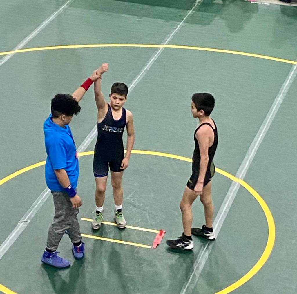 Caleb Aube (JYWC) gets his hand raised in victory over Maxwell Shellabarger (Dillingham Wrestling Club) at the USA Wrestling Alaska State Championships at the Menard Center in Wasilla from May 3-7. (Courtesy Photo / William Dapcevich)