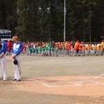 High school and Little League baseball and softball teams bow their heads during invocation for Gastineau Channel Little League's opening day Saturday at Adair-Kennedy Memorial Park. (Ben Hohenstatt / Juneau empire
