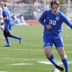 TMHS sophomore Kajson Cunningham (30) dribbles the ball against Ketchikan High School who traveled to Juneau for two games on Friday and Saturday. Cunningham plays for both the junior varsity and varsity teams. (Jonson Kuhn / Juneau Empire)