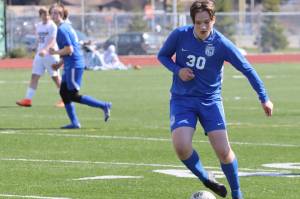 TMHS sophomore Kajson Cunningham (30) dribbles the ball against Ketchikan High School who traveled to Juneau for two games on Friday and Saturday. Cunningham plays for both the junior varsity and varsity teams. (Jonson Kuhn / Juneau Empire)