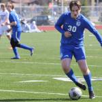 TMHS sophomore Kajson Cunningham (30) dribbles the ball against Ketchikan High School who traveled to Juneau for two games on Friday and Saturday. Cunningham plays for both the junior varsity and varsity teams. (Jonson Kuhn / Juneau Empire)