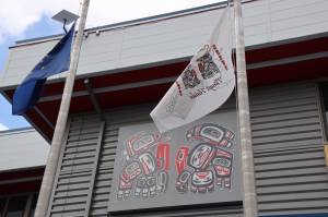 A breeze lifts flags hanging outside of the Andrew Hope Building in downtown Juneau Monday afternoon. The Central Council of the Tlingit & Haida Indian Tribes of Alaska announced Monday morning its withdrawal from the Alaska Federation of Natives. (Clarise Larson / Juneau Empire)