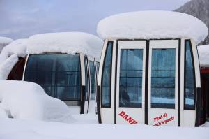 Snow covers the gondola that the City and Borough of Juneau purchased from Galsterberg Ski Area in Austria as it sits scattered in the snow outside Eaglecrest Ski Area in February. At Monday nights Assembly meeting the Assembly approved a deal in which Goldbelt Inc. will invest $10 million toward the installation and construction of the gondola project. (Clarise Larson / Juneau Empire File)