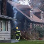 Firefighters respond Monday evening to the site of a structure fire on Meander Way. Three people and a dog made it out of the residence without suffering injuries, according to Capital City Fire/Rescue Fire Marshal Dan Jager, but a cat was determined to be deceased as a result of the blaze. (Ben Hohenstatt / Juneau Empire)