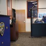 A Transportation Security Administration officer checks luggage at the Juneau International Airport in March. (Clarise Larson / Juneau Empire File)