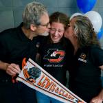 Mackenzie Olver is kissed by parents Barry and Stacy after signing a national letter of intent on Thursday in the Thunder Mountain commons, to play soccer and study at Lewis & Clark College in Portland, Oregon. (Klas Stolpe / Juneau Empire)