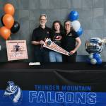Mackenzie Olver, with parents Barry and Stacy Olver, after signing a national letter of intent on Thursday in the Thunder Mountain commons, to play soccer and study at Lewis & Clark College in Portland, Oregon. (Klas Stolpe / Juneau Empire)
