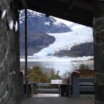 The Mendenhall Glacier is seen through the entrance of a pavilion near the Mendenhall Glacier Visitor Center on Friday. The area surrounding the visitor center will see significant changes under a plan to overhaul the Mendenhall Glacier Recreation Area. (Ben Hohenstatt / Juneau Empire)
