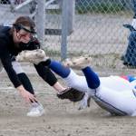 Thunder Mountain freshman third baseman Cambry Lockhart tags out Sitka base runner Adriana Denkiner during the Falcons 11-3 win over the Lady Wolves, Thursday, at Dimond Park. (Klas Stolpe / Juneau Empire)