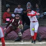 Juneau-Douglas High School: Yadaa.at Kalé senior Zoey Billings (1) and Ketchikan senior catcher Faith Easterly watch a single begin during the Crimson Bears and Lady Kings tie on Thursday at Melvin Park. (Klas Stolpe / Juneau Empire)