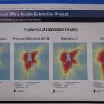 This is a picture of a poster that was hung on the wall of the Angoon city community center Friday afternoon during a meeting about the four alternatives for the Hecla Greens Creek Mine North Extension Project. The poster outlined the fugitive dust deposition density of each proposal, including the no-action alternative. (Clarise Larson / Juneau Empire)