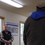 Hecla Greens Creek environment/surface operations manager Martin Stearns (left) listens to Angoon resident Floyd Kim express his opposition to the four alternatives for the Hecla Greens Creek Mine North Extension Project, of which includes expanding its 8.5-million-cubic yard disposal facility to hold up to an additional five million cubic yards of tailings and waste rock storage. Kim was among the around 15 residents who joined the meeting held Friday afternoon in Angoon. (Clarise Larson / Juneau Empire)