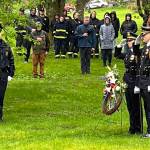 Lt. Krag Campbell salutes members of the Inter-Agency Honor Guard as wreaths were laid at the graves of Chief of Detectives Donald Thomas Dull and Officer Richard J. Adair on Friday during the Alaska Peace Officers Associations annual memorial service at Evergreen Cemetery. (Jonson Kuhn / Juneau Empire)